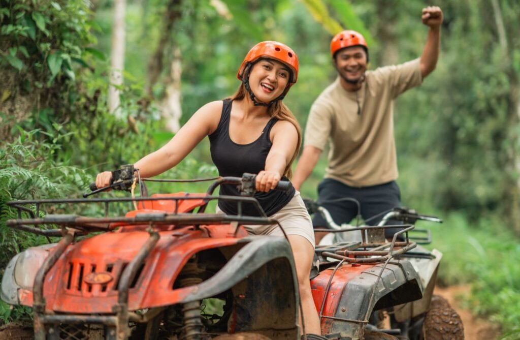 Authentic Bali experiences with a couple riding an ATV through lush Balinese jungle trails